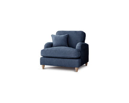 Blue armchair with a pillow on a white background