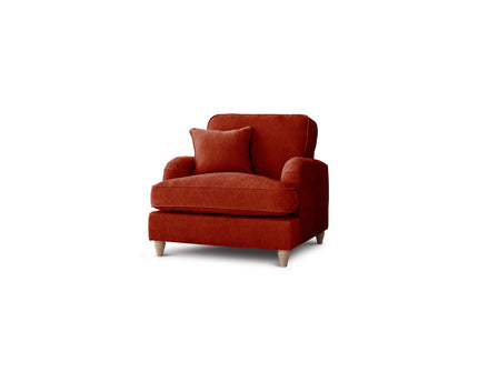 Red armchair with a cushion on a white background